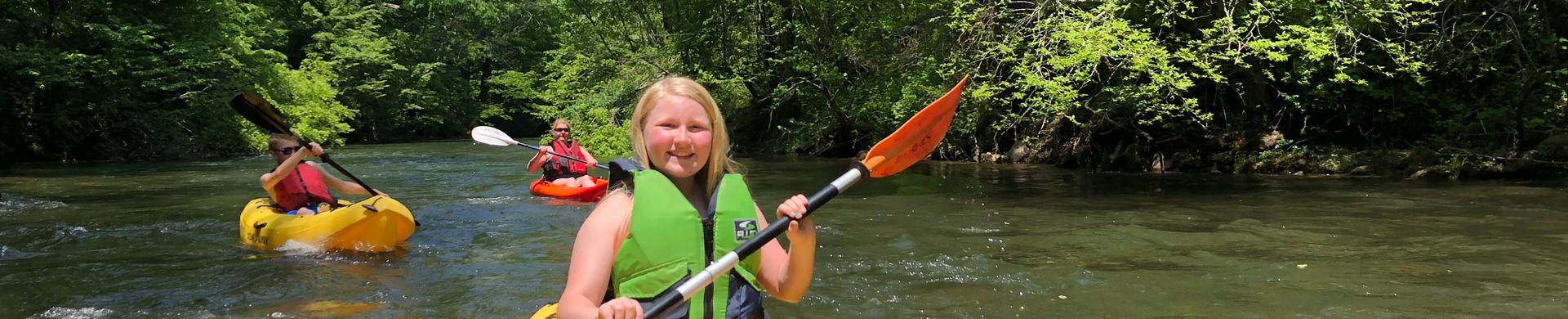 Young lady riding a Kayak