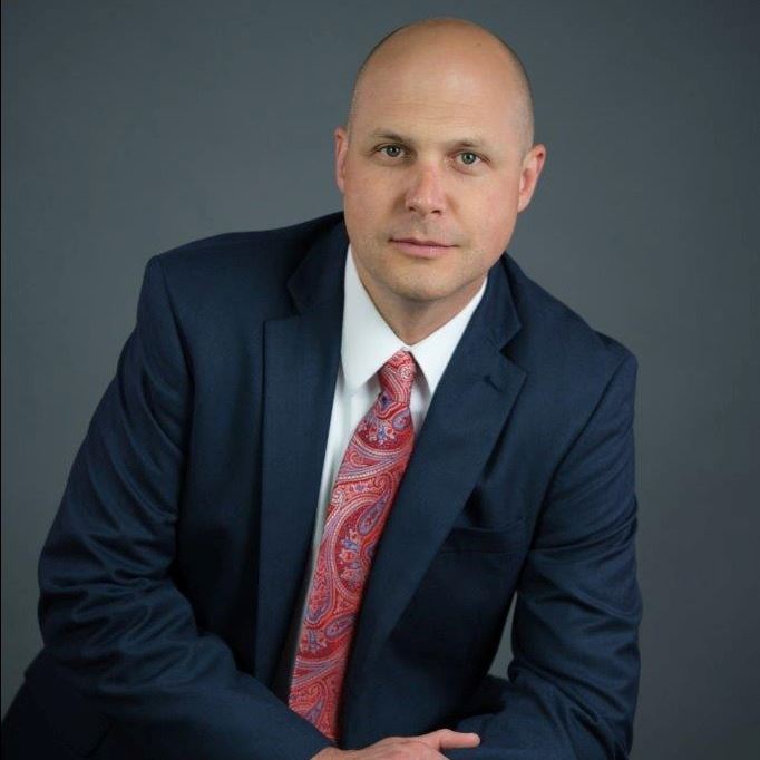 Andrew Nester leaning on a propped up knee