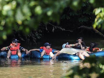 People riding tubes in the river